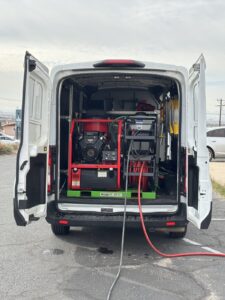 Hot-water pressure washing equipment in a Kitchen Guard of El Paso service van