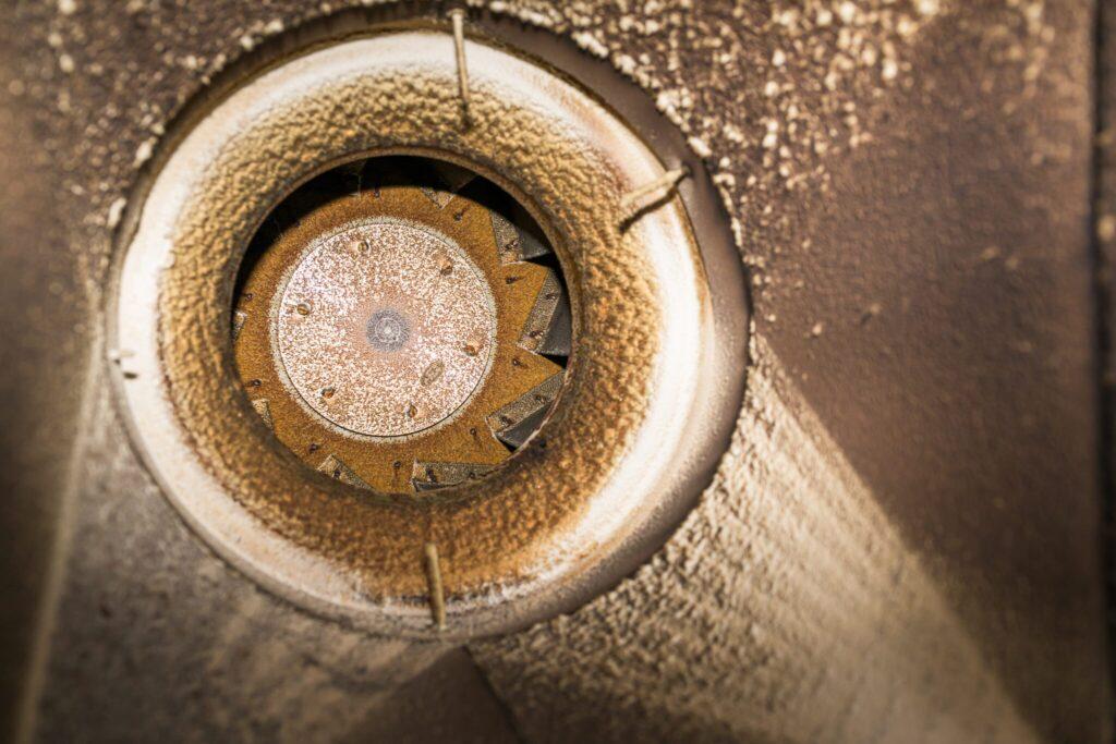 Grease buildup inside an exhaust duct below the fan