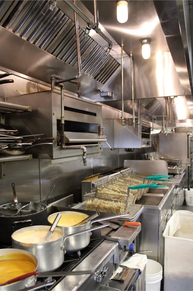 Kitchen Guard technician degreasing commercial kitchen exhaust filters and ductwork near Athens, Georgia
