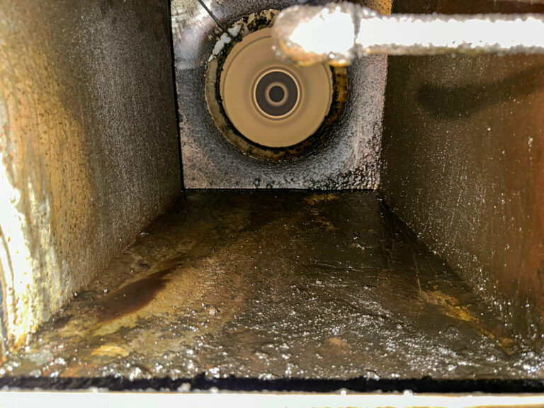 Commercial kitchen exhaust duct heavily loaded with cooking grease