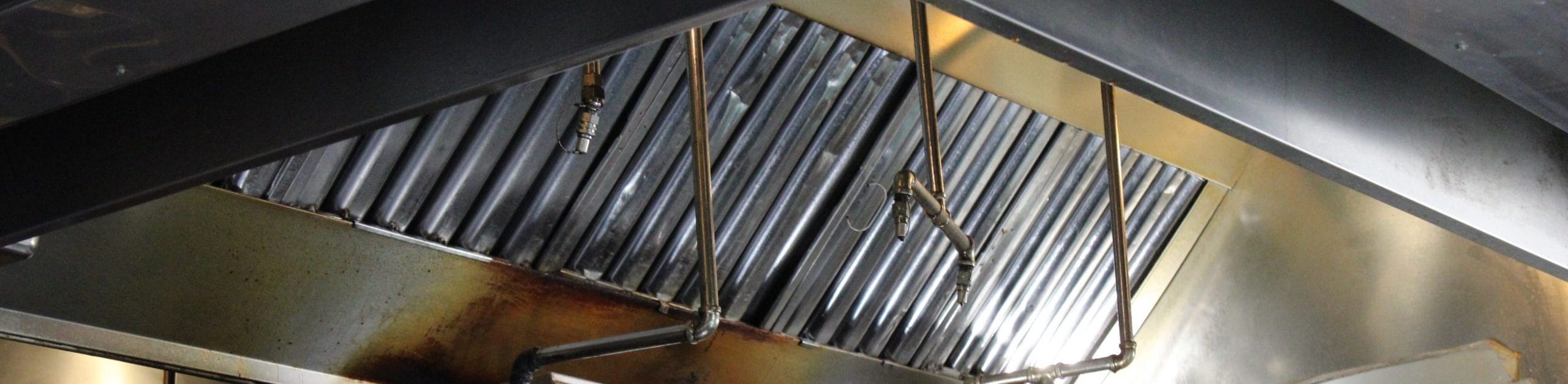 Closeup image of pipes of a kitchen vent system